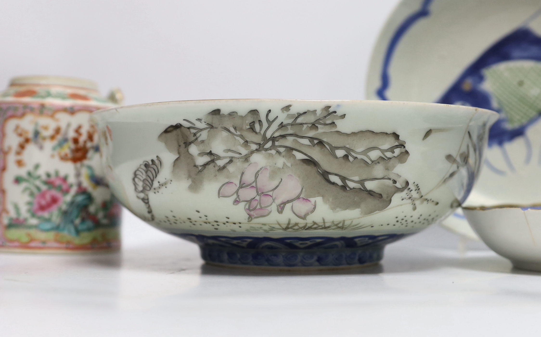 A Chinese famille rose teapot, a bowl and two dishes, bowl 24.5cm diameter